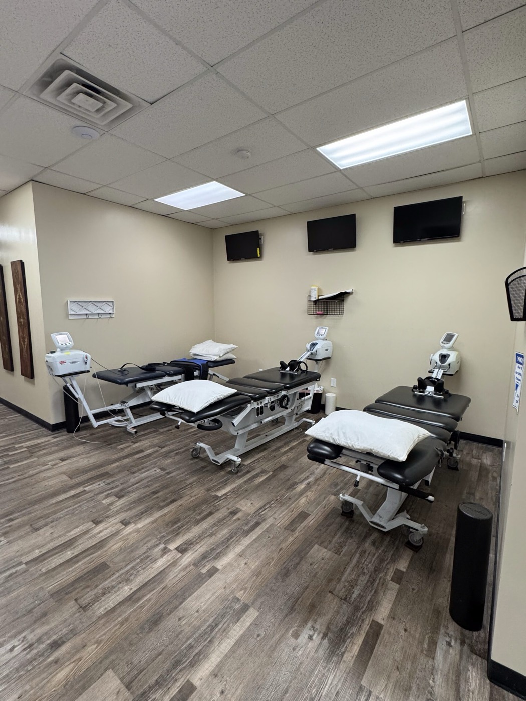 Treatment tables in an open care area inside Missouri Injury Clinic