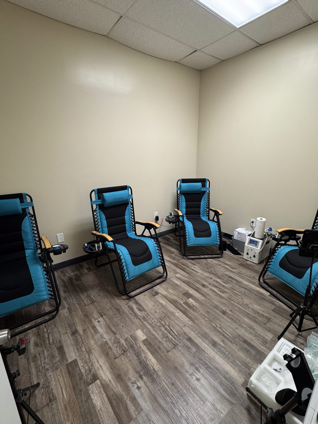 Reclining therapy chairs and equipment in a treatment area inside Missouri Injury Clinic